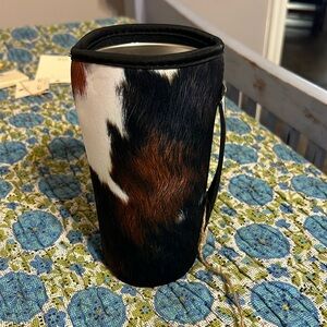Really cute faux cowhide cup or tea holder with handle.